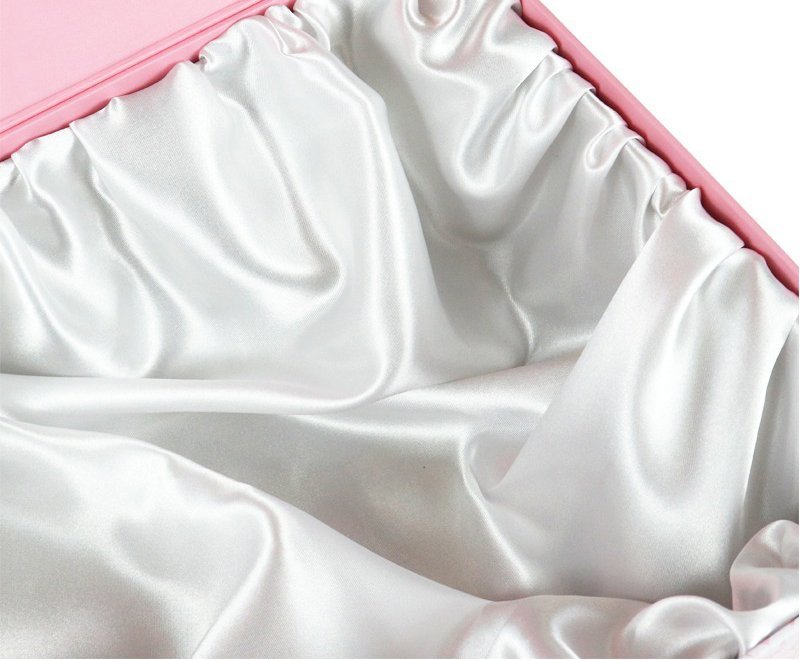 A close-up view of the soft lining inside the pink floral patterned custom gift box.